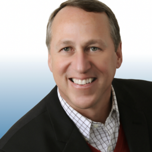 Smiling male Equity team member in black blazer, professional headshot
